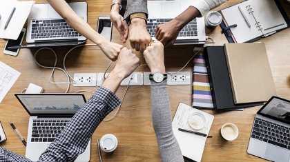 Colleagues giving a fist bump