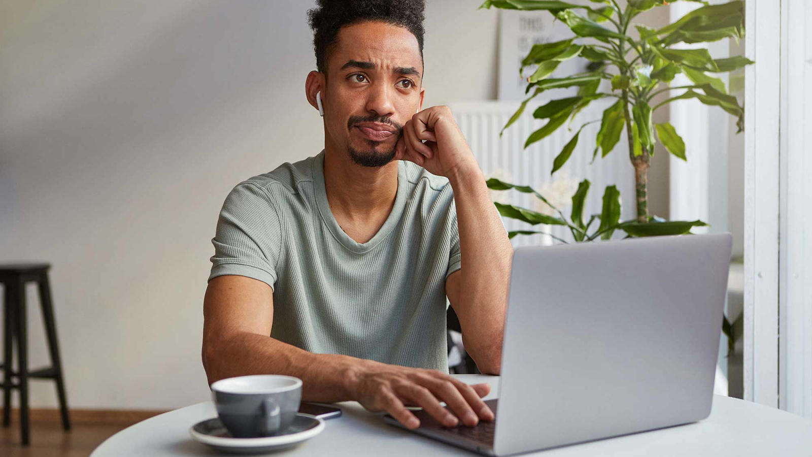 Don’t Hesitate!_portrait-frowning-young-attractive-african-american-thinking-boy-sits-cafe-works-laptop-touches-cheek-sadly-looks-up-thinks-about-deadline