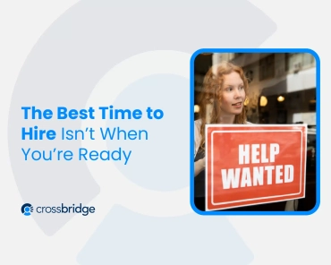 Woman holding hiring sign