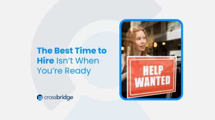 Woman holding hiring sign